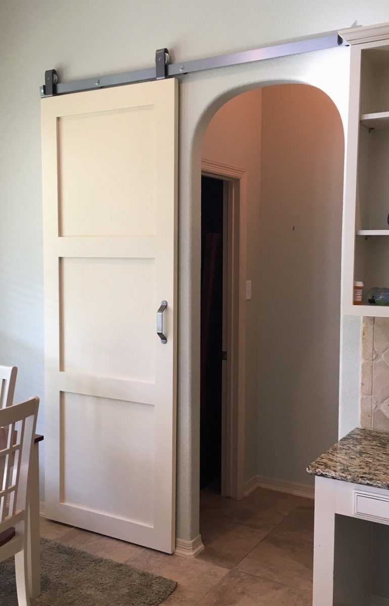 Contemporary style barn door in Boston kitchen.